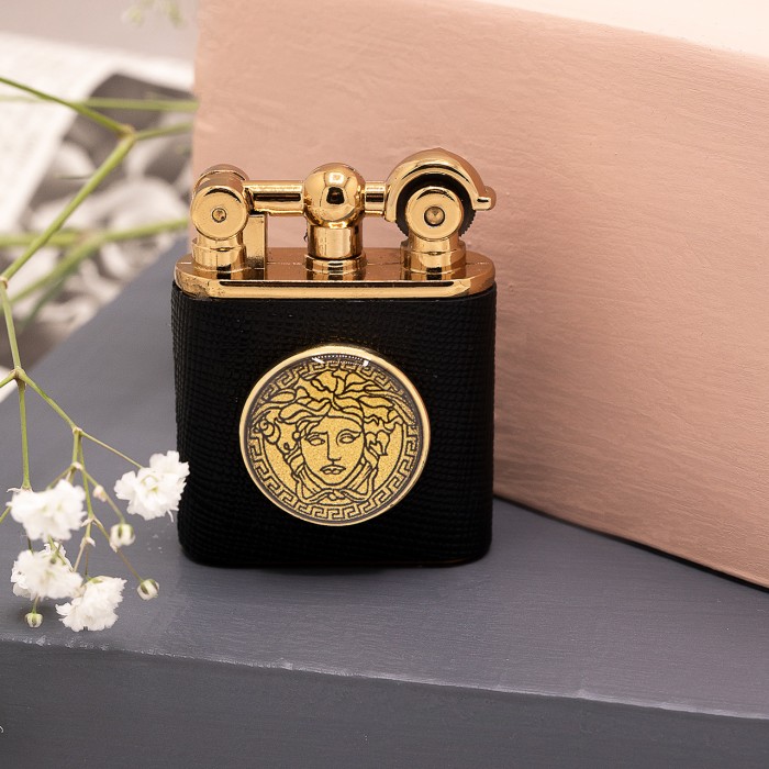 ست چرم هرمس روکش طلا طرح ورساچ (دستبند چرم ، جاکلیدی و فندک)